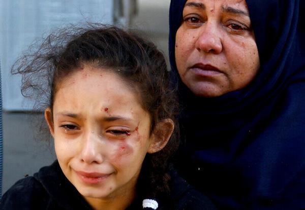 A Palestinian girl reacts in the aftermath of a strike amid the co<em></em>nflict with Israel in Khan Younis, in the southern Gaza Strip on October 12. —Reuters